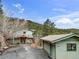 Charming home with a front yard, lush greenery, an outbuilding and beautiful surroundings at 994 Timber Ln, Boulder, CO 80304
