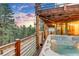 Relaxing hot tub on a deck with forest views, perfect for unwinding and enjoying the serene surroundings at 994 Timber Ln, Boulder, CO 80304