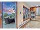 Gourmet kitchen flows to the deck and outdoor seating with mountain views at 994 Timber Ln, Boulder, CO 80304