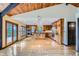 Spacious, updated kitchen with hardwood floors, access to the patio, and ample natural light throughout the space at 994 Timber Ln, Boulder, CO 80304