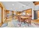 Bright, open kitchen features wooden cabinetry, stainless steel appliances, and adjacent dining area at 994 Timber Ln, Boulder, CO 80304