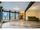 Inviting living room with wood beam, hardwood floors, large windows, and comfortable seating at 994 Timber Ln, Boulder, CO 80304