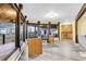 Bright living space with wood floors, large windows, and an adjacent kitchenette, perfect for entertaining at 994 Timber Ln, Boulder, CO 80304