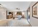 Spacious main bedroom featuring carpeted floors, ceiling fan, large bed, and balcony access at 994 Timber Ln, Boulder, CO 80304