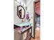 Stylish powder room features a glass vessel sink, modern fixtures, and wood accents at 994 Timber Ln, Boulder, CO 80304