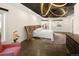 Stylish bedroom with a unique headboard, modern lighting, hardwood floors, and an access door to an outside deck at 418 Steele St, Denver, CO 80206