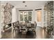 Elegant dining room featuring a marble fireplace, modern lighting, wine storage, and stylish chairs around a large table at 418 Steele St, Denver, CO 80206