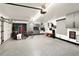 Spacious garage with epoxy floor, storage cabinets, and organization system for bikes and gear at 418 Steele St, Denver, CO 80206