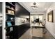 Modern home office with custom built-ins, granite countertops, ample natural light, and wood flooring at 418 Steele St, Denver, CO 80206