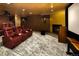 Basement home theater boasts comfortable seating and a cozy fireplace at 418 Steele St, Denver, CO 80206