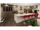 A gourmet kitchen with a large center island, stainless steel appliances, and modern lighting at 418 Steele St, Denver, CO 80206