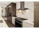 Contemporary kitchen featuring premium appliances and elegant marble countertops and backsplash at 418 Steele St, Denver, CO 80206
