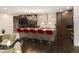 Spacious kitchen with an island, modern lighting, stainless steel appliances, and hardwood floors at 418 Steele St, Denver, CO 80206
