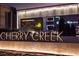 Illuminated Cherry Creek neighborhood signage, with nearby dining and businesses at 418 Steele St, Denver, CO 80206