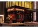 Exterior shot of 801 Chophouse restaurant, features architecture, signage, and sculptures at 418 Steele St, Denver, CO 80206