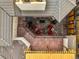 Outdoor rooftop patio with spiral staircase, seating area with firepit and patio brick flooring at 418 Steele St, Denver, CO 80206
