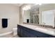 Sleek bathroom features a double sink vanity, granite countertops, and a tiled shower at 5072 Silver Hare Ln, Castle Rock, CO 80104