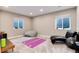 Bright bonus room with large windows, exercise equipment, and neutral color palette at 5072 Silver Hare Ln, Castle Rock, CO 80104
