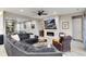 Inviting living room featuring a modern fireplace and a comfortable gray sectional sofa at 5072 Silver Hare Ln, Castle Rock, CO 80104