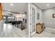 Open-concept living room with hardwood floors, iron banister, and views of the dining area at 5072 Silver Hare Ln, Castle Rock, CO 80104