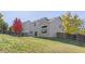 Landscaped backyard with a large grassy area and wooden fence at 11002 Glacier Park Cir, Parker, CO 80138