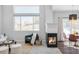 Living room with a fireplace, sitting area, and adjacent dining area at 11002 Glacier Park Cir, Parker, CO 80138