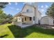 Spacious backyard featuring a covered patio and plenty of green space at 9908 Garfield Ct, Thornton, CO 80229