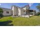 The backyard has a well-maintained lawn and patio, perfect for outdoor entertaining at 9908 Garfield Ct, Thornton, CO 80229