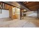 Unfinished basement with wooden beams, bare walls, and concrete floor ready to customize at 9908 Garfield Ct, Thornton, CO 80229