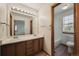 Bright bathroom with double vanity, and a view of the connecting room at 9908 Garfield Ct, Thornton, CO 80229