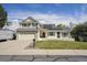 Charming two-story home with a manicured lawn and a two-car attached garage at 9908 Garfield Ct, Thornton, CO 80229