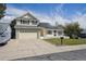 Inviting two-story house featuring a well-maintained lawn and a spacious driveway at 9908 Garfield Ct, Thornton, CO 80229