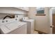 Practical laundry room with side-by-side washer and dryer for convenient chores at 9908 Garfield Ct, Thornton, CO 80229