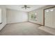 Cozy living room with neutral carpet, white walls and a window for natural light at 9908 Garfield Ct, Thornton, CO 80229
