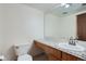 Bright bathroom featuring a sleek vanity with granite countertop and a modern toilet at 4866 S Dudley St # 2, Littleton, CO 80123