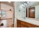 Bathroom vanity with lighting, faucet, and mirror at 4866 S Dudley St # 2, Littleton, CO 80123