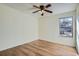 Bedroom boasts hardwood floors and a window at 4866 S Dudley St # 2, Littleton, CO 80123