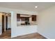 Kitchen view featuring white countertop and cherry stained cabinets at 4866 S Dudley St # 2, Littleton, CO 80123