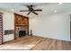 Bright living room featuring wood floors and a stone fireplace at 4866 S Dudley St # 2, Littleton, CO 80123