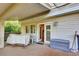 A covered deck with room for seating and storage is just off the main living area at 5622 E Weaver Cir, Centennial, CO 80111