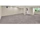 Finished basement with neutral carpet, recessed lighting, and access to an en suite bathroom at 5622 E Weaver Cir, Centennial, CO 80111