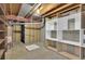 Unfinished basement area with concrete floor, utilities, and exposed ductwork at 5622 E Weaver Cir, Centennial, CO 80111