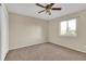 Bedroom with carpet, a ceiling fan, and a window with view of the outdoors at 5622 E Weaver Cir, Centennial, CO 80111