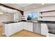 Beautiful kitchen featuring white cabinets, granite countertops, and stainless steel appliances at 5622 E Weaver Cir, Centennial, CO 80111