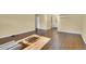 Spacious living room with hardwood floors, natural lighting, and access to the on-suite bathroom at 5622 E Weaver Cir, Centennial, CO 80111