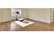 Open recreation room with hardwood floors, and natural lighting with access to the on-suite bathroom at 5622 E Weaver Cir, Centennial, CO 80111