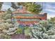 Welcome to Cherry Park with a brick sign and mature trees at 5622 E Weaver Cir, Centennial, CO 80111