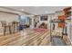 Finished basement area featuring bar-height seating, gym equipment, entertainment, and recessed lights at 55610 E 40Th Ave, Strasburg, CO 80136