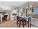 Open dining area with hardwood floors, tile, and lots of natural light at 55610 E 40Th Ave, Strasburg, CO 80136