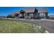 This home has an extensive porch, natural wood accents, and a gravel driveway at 55610 E 40Th Ave, Strasburg, CO 80136